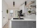 Modern kitchen featuring white cabinets, stainless steel appliances, and a bright, open layout at 561 Cherokee St, Denver, CO 80204