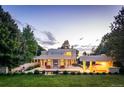 Expansive backyard oasis featuring a pool, patio, and outdoor kitchen at 52 Sedgwick Dr, Cherry Hills Village, CO 80113