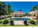 Inviting pool area with plenty of space for relaxation and entertainment at 52 Sedgwick Dr, Cherry Hills Village, CO 80113