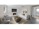 Cozy living room featuring a fireplace, contemporary furniture, and ample space at 16563 E Kansas Pl, Aurora, CO 80017