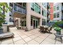 Private patio with seating area and fire pit at 1401 Wewatta St # 204, Denver, CO 80202