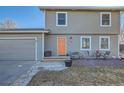 Traditional two-story home with a well-kept lawn and a cozy front seating area perfect for enjoying the outdoors at 114 Walnut Dr, Frederick, CO 80530