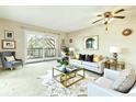 Bright living room featuring a balcony, modern furniture, and stylish decor at 745 S Alton Way # 9B, Denver, CO 80247