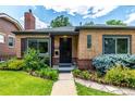 Lovely brick home showcases fresh landscaping and a welcoming front entrance at 1635 Poplar St, Denver, CO 80220