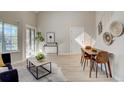 Cozy living room featuring natural light, dining area, and a bright interior at 5950 Gunbarrel Ave # F, Boulder, CO 80301