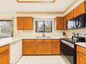 Well-lit kitchen featuring ample counter space, modern appliances, and a window over the sink at 8777 W Cornell Ave # 2, Lakewood, CO 80227