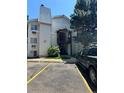 Exterior view of a well-maintained apartment building with visible unit numbers and parking at 17361 E Mansfield Ave # 521R, Aurora, CO 80013