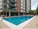 Inviting outdoor pool with lounge chairs and a surrounding patio at 550 E 12Th Ave # 1501, Denver, CO 80203