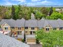 Aerial shot of townhomes showing back patios, garages, and mountain views at 3712 Wolff St, Denver, CO 80212