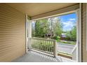 Covered porch featuring a view of a tree-lined street and neighborhood at 3712 Wolff St, Denver, CO 80212