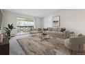 Inviting living room features a balcony and neutral decor, perfect for relaxation at 755 S Alton Way # 8D, Denver, CO 80247