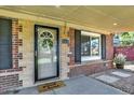 Close-up of front door and brick, showcasing the charming entrance and address at 2810 Oneida St, Denver, CO 80207