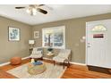 Cozy living room with hardwood floors, natural light, and stylish decor at 2810 Oneida St, Denver, CO 80207