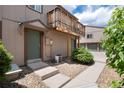 Inviting entrance featuring front door, landscaping, walkway and stairs leading up to the home at 7700 W Glasgow Pl # 24C, Littleton, CO 80128