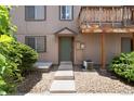 Inviting entrance with a charming front door, landscaping, and walkway leading to the home at 7700 W Glasgow Pl # 24C, Littleton, CO 80128