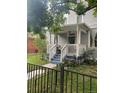 Inviting front porch with white railings and space for seating at 3098 W 39Th Ave, Denver, CO 80211