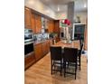 Modern kitchen featuring stainless steel appliances and a center island at 3098 W 39Th Ave, Denver, CO 80211