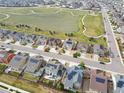 Aerial view of the neighborhood showcasing proximity to neighborhood park, roadways, and other residences at 5362 E 140Th Pl, Thornton, CO 80602