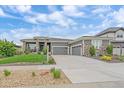 Beautiful single-Gathering home featuring a three-car garage and manicured landscaping at 9433 Torrey Way, Arvada, CO 80007