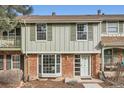 Charming two-story townhouse with brick accents and well-maintained landscaping at 2729 E Geddes Pl, Centennial, CO 80122