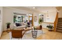 Cozy living room with natural light, modern decor, and an open staircase, blending comfort with contemporary design elements at 1460 Quince Ave # 102, Boulder, CO 80304