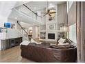 Cozy living room showcasing a fireplace, built-in shelving, and a comfortable seating area at 13132 Pennsylvania Cir, Thornton, CO 80241