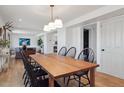 Bright dining room with hardwood floors and classic furnishings; spacious and open to the living area at 4179 E Peakview Cir, Centennial, CO 80121