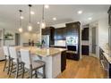 Modern kitchen with stainless steel appliances, granite countertops, and a spacious island at 17637 W 87Th Ave, Arvada, CO 80007