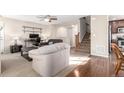 Open-concept living room flows seamlessly into the dining area and kitchen at 9139 W 104Th Cir, Westminster, CO 80021