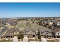 Expansive aerial view of the community with walking paths and stunning natural landscapes at 11916 S Meander Way, Parker, CO 80138