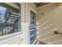 Inviting front entrance with a decorative wreath and plenty of natural light. Unit F at 7835 Barbara Ann Dr # F, Arvada, CO 80004