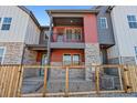 Charming townhome featuring colorful siding, stone accents, and private balconies at 2849 E 103Rd Dr, Thornton, CO 80229