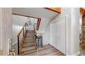 Modern staircase featuring wood steps, a sleek metal railing, and an open design that adds a touch of elegance at 7567 Parkview Mtn, Littleton, CO 80127