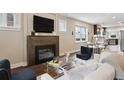 Comfortable living room with a fireplace, hardwood floors, and neutral decor at 815 S Gaylord St, Denver, CO 80209