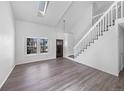 Bright living room featuring vaulted ceilings, skylights, and modern finishes at 4658 E 107Th Ave, Thornton, CO 80233