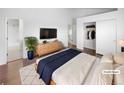 Stylishly staged main bedroom with walk in closet and ensuite bathroom at 4658 E 107Th Ave, Thornton, CO 80233