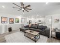 Open living area showcasing a contemporary aesthetic and seamless flow to the kitchen at 8175 Sewanee Peak St, Littleton, CO 80125