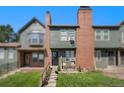 Brick townhouse with a small front yard and steps leading to the entrance at 17111 E Stanford Ave # C, Aurora, CO 80015