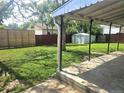 Large backyard area with covered patio and shed offers ample space for outdoor activities at 7331 Clay St, Westminster, CO 80030