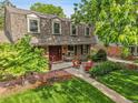 Beautiful home with manicured landscaping and a cozy front patio seating area at 7030 S Fillmore Ct, Centennial, CO 80122