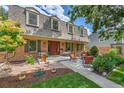 Inviting front porch with outdoor seating, perfect for relaxing and enjoying the neighborhood views at 7030 S Fillmore Ct, Centennial, CO 80122