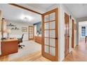 Bright office space with wood floors, desk, chair and doors at 7030 S Fillmore Ct, Centennial, CO 80122