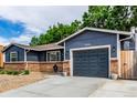 Pleasant single-story house with brick features and gravel landscaping leading to the front at 8696 W 86Th Cir, Arvada, CO 80005