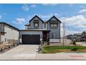 Charming two-story home with a well-manicured lawn and a spacious two-car garage at 6454 Leathers Ln, Parker, CO 80134