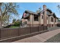 Brick home with a fenced yard, offering privacy and a well-maintained lawn at 1399 Newton St, Denver, CO 80204