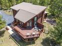 Aerial view of the back of the house showing the deck with outdoor furniture and well-maintained roof at 173 Silver Cloud Ln, Boulder, CO 80302