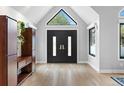 Bright foyer featuring hardwood floors, a grand front door, and modern finishes at 5859 E Ida Pl, Greenwood Village, CO 80111