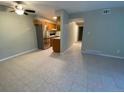 Spacious, open-concept living room with stainless steel appliances, tile floor and great natural light at 100 E Highline Cir # 105, Centennial, CO 80122