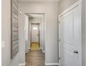 Bright entryway with wood-look floors and neutral walls at 847 Ledge St, Lochbuie, CO 80603