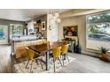 Bright dining room featuring hardwood floors, modern lighting, and a stylish design adjacent to the kitchen at 4661 14Th St, Boulder, CO 80304